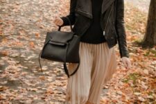 With sunglasses, black turtleneck, black leather tote bag and white lace up flat shoes