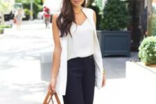 With sunglasses, white loose top, golden necklace, brown leather tote bag and beige ankle strap high heels