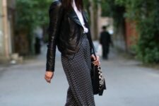 With white and black wide brim hat, white shirt, black and leopard printed bag and printed flat shoes