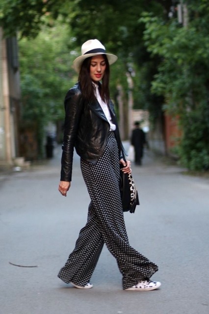 With white and black wide brim hat, white shirt, black and leopard printed bag and printed flat shoes