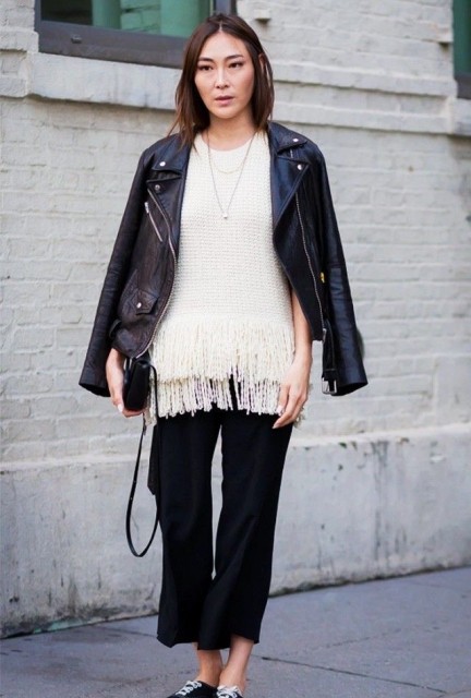 With white fringe shirt, silver necklace, black leather mini bag and black and white sneakers