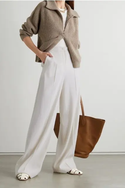 With white t-shirt, golden necklace, brown leather tote bag and beige flat shoes