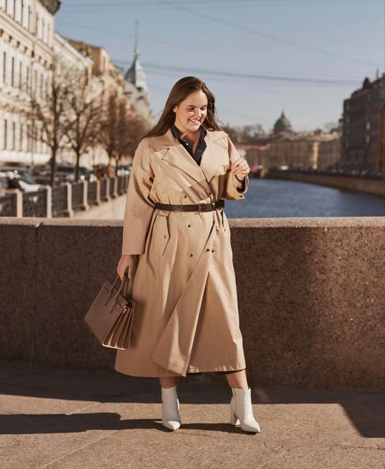 a black shirtdress, a beige midi trench, white boots and a brown bag are a simple and lovely look for spring