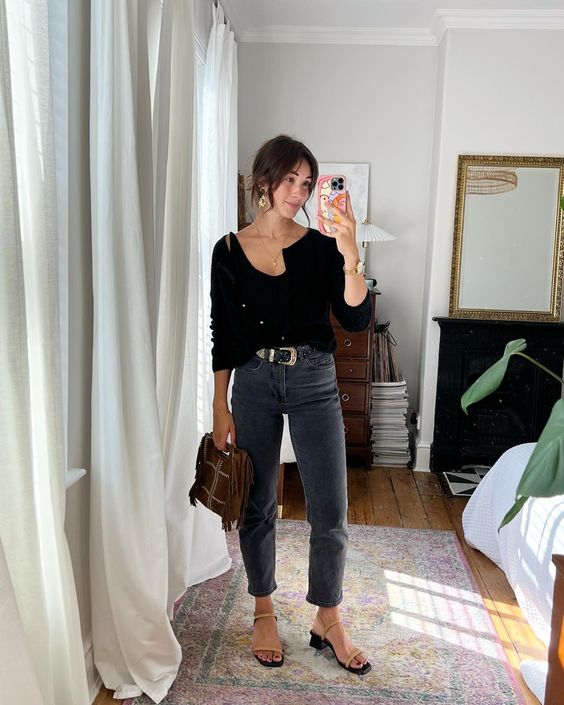 a black top and a cropped cardigan, graphite grey jeans, nude strappy shoes and a brown bag for a girlish and chic spring look