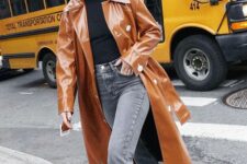 a black top, grey jeans, white cowboy boots, an amber lacquer leather trench are a great look with a touch of color