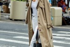 a white top, white jeans, black loafers, a beige trench and a black bag are a great combo for spring, it’s a lovely outfit