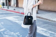grey jeans, an oversized white button down, black lacquer boots, a black bag are a simple and cool look for spring