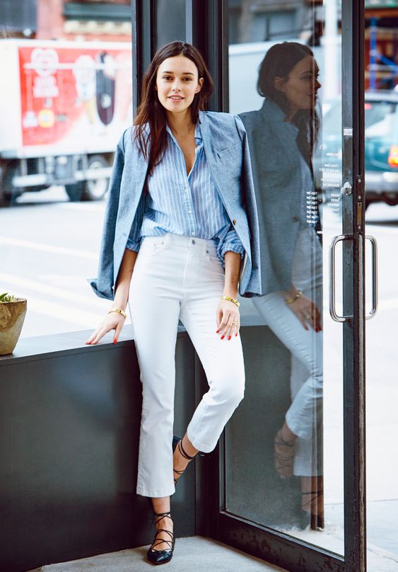 a blue striped shirt, a blue blazer, white jeans and black lace up flats for a classy French chic look