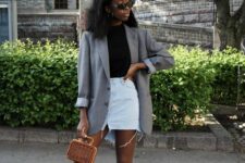 a spring to summer look with a black top, a white denim mini, a grey oversized blazer, lace up heels and a small woven bag