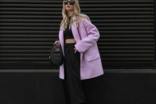 11 a black crop top, trousers and a bag, a lilac oversized blazer and white trainers are a fresh and cool spring look