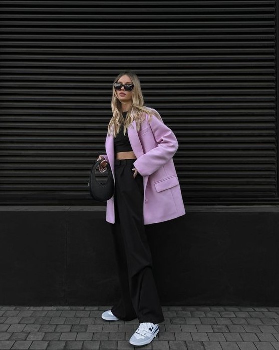 a black crop top, trousers and a bag, a lilac oversized blazer and white trainers are a fresh and cool spring look