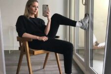 12 a black jumper and leggings, white socks, grey New Balance trainers are a simple and cozy look for every day