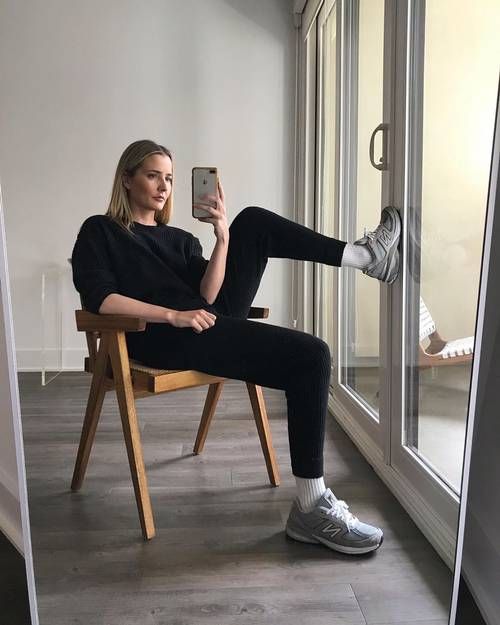 a black jumper and leggings, white socks, grey New Balance trainers are a simple and cozy look for every day