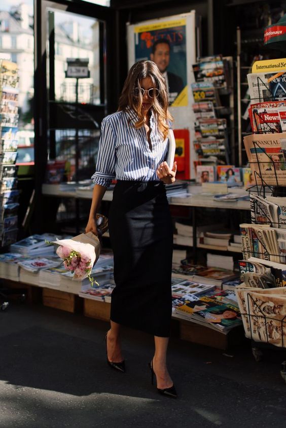 a classic blue striped shirt, a black pencil midi skirt, black shoes are a refined and cool Parisian-style outfit for spring