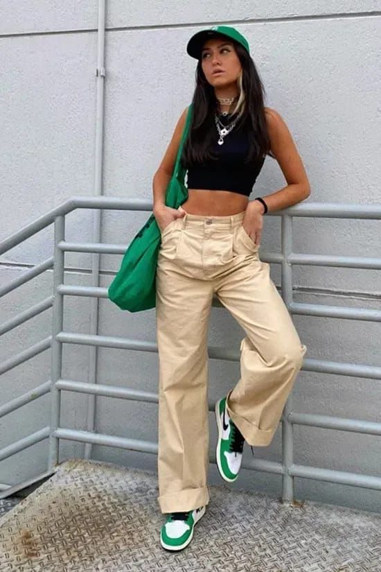 a black crop top, beige trousers, green Jordan sneakers, a green cap and a tote plus layered necklaces