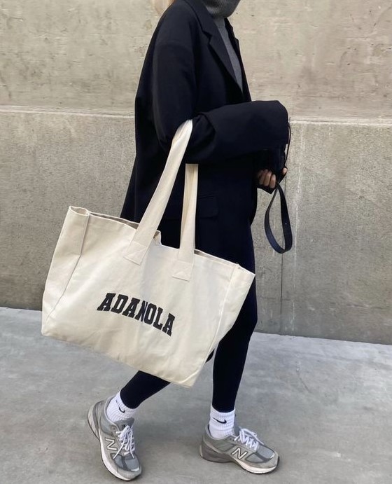 a comfy outfit with a grey turtleneck, black leggings, an oversized blazer, grey trainers and white socks, a neutral canvas bag