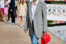 18 a white button down, blue jeans, an oversized grey blazer, navy embellished kitten heels and a bold red bag for work