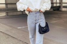 27 a creamy sweatshirt, bleached blue jeans, black and white Jordan trainers, a black mini bag and statement earrings are cool for spring