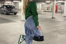 28 a green cropped jumper, blue straight leg jeans, green Jordan sneakers, a black mini bag are a cool look for the fall