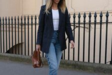 28 a simple office look with a white tank top, blue jeans, a navy blazer, white New Balance trainers and a brown bag