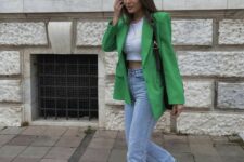 30 a white crop top, bleached blue jeans, grene Jordan sneakers, a green oversized blazer and a black bag for spring