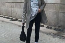 32 an athleisure look with a grey oversized t-shirt, black leggings, white trainers and socks, a black bag and a grey oversized blazer