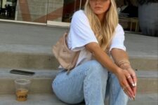 33 a white tee, bleached blue jeans, green Jordan sneakers, a green cap, a blush mini bag for spring and summer