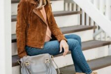 With beige shirt, beige suede heeled ankle boots and gray leather bag