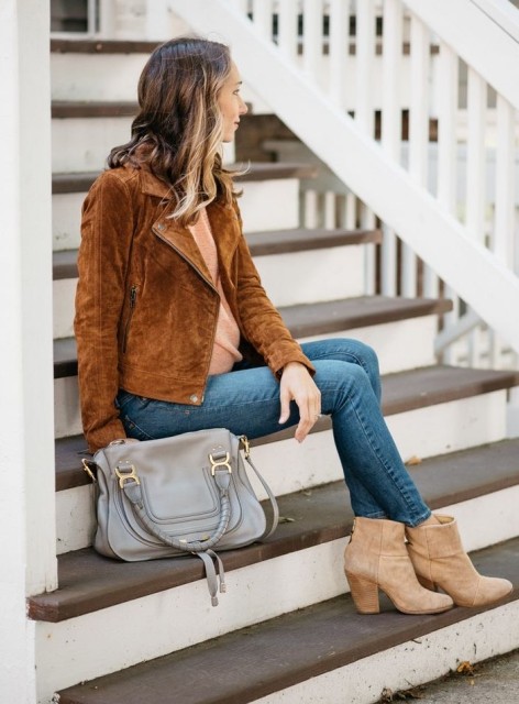 With beige shirt, beige suede heeled ankle boots and gray leather bag