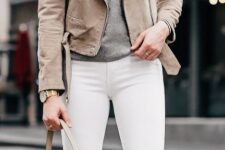 With gray sweatshirt and beige leather tote bag