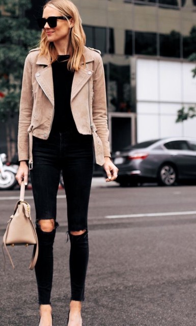 With oversized sunglasses, black shirt, beige leather bag and black high heels