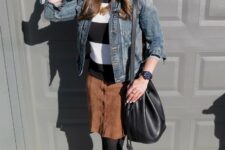 With purple and black wide brim hat, oversized sunglasses, black and white striped shirt, golden necklace, black leather bag, black tights and black leather ankle boots