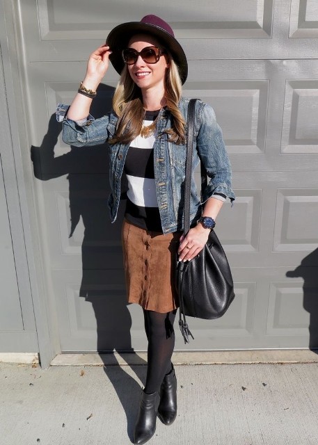 With purple wide brim hat, black and white striped shirt, black leather bag, black tights and black leather ankle boots