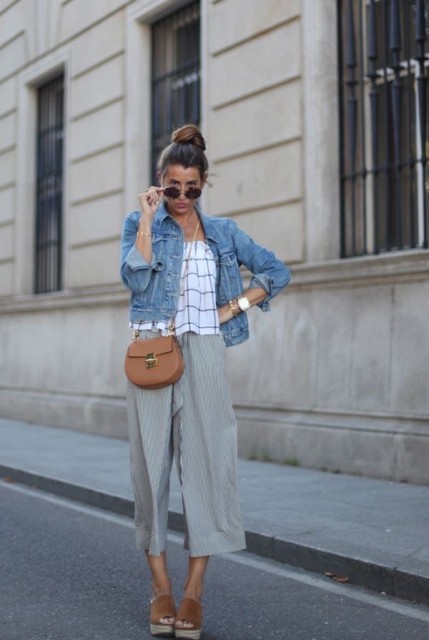 With rounded sunglasses, brown leather chain strap bag, checked top and brown platform shoes