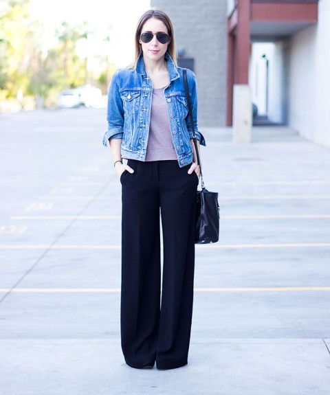 With sunglasses, lilac shirt, black leather bag and high heels