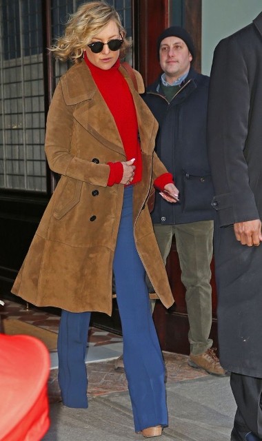 With sunglasses, red turtleneck and beige platform shoes