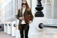 With sunglasses, white turtleneck, brown leather clutch and gray suede pumps