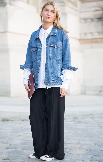 With white button down long sleeved shirt, marsala leather clutch and black and white sneakers