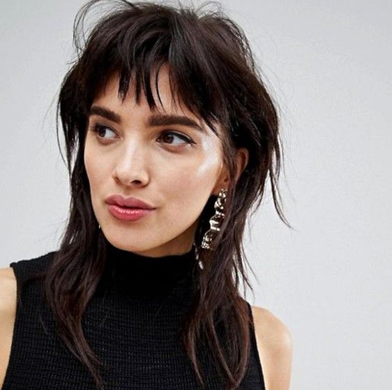 a beautiful mullet haircut in a dark chestnut shade, with fringe and shoulder-length is cool