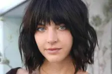 a black choppy bob with bangs and waves is a lovely idea to rock and it looks fresh, bold and rebellious