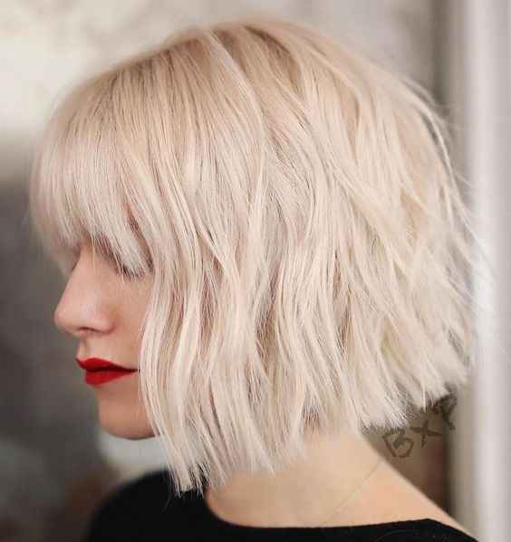 a fabulous icy blonde choppy bob with outgrown bangs is a gorgeous idea to rock right now