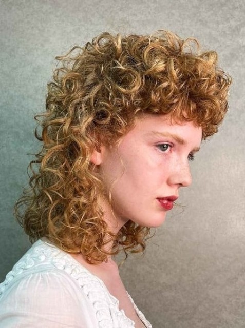 a honey-colored permed mullet as perms are great for achieving volume and fullness, and the modern approach is a far less damaging process