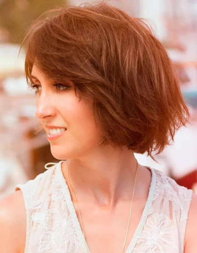 a layered medium choppy bob features long twisty layers that frame up the front, adding more interest to the whole look