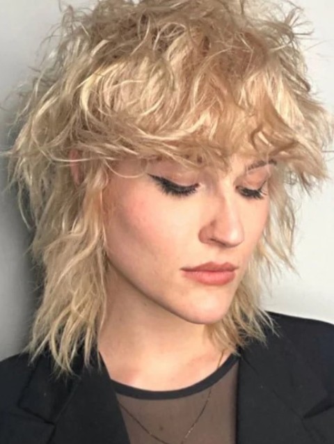 a messy and textural blonde mullet will highlight the layers in your cut and make the mullet look more defined
