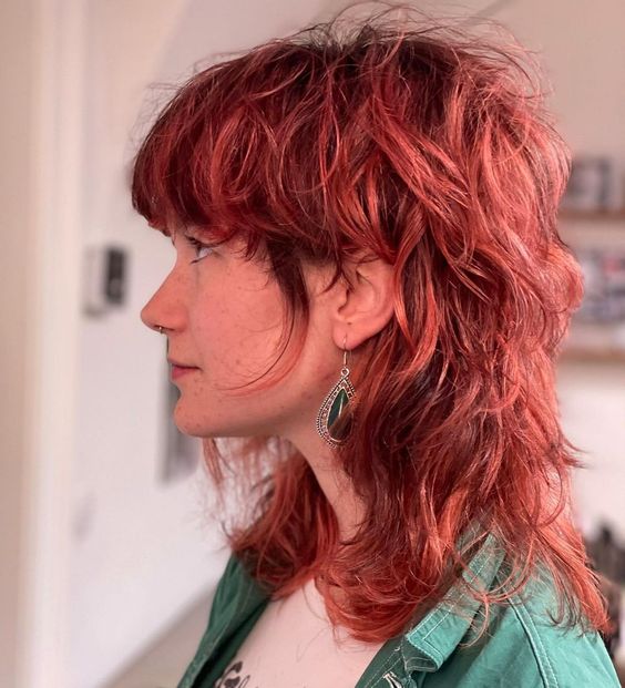 a modern shaggy burgundy-colored wavy mullet is a lovely idea for those who want much color and interest