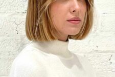 a pretty brown to blonde ombre bob with short curtain bangs that are done icy blonde is a cool and catchy idea