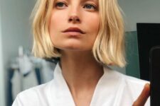 a pretty textural blonde bob with waves and central part is a catchy and lovely idea for a modern girl