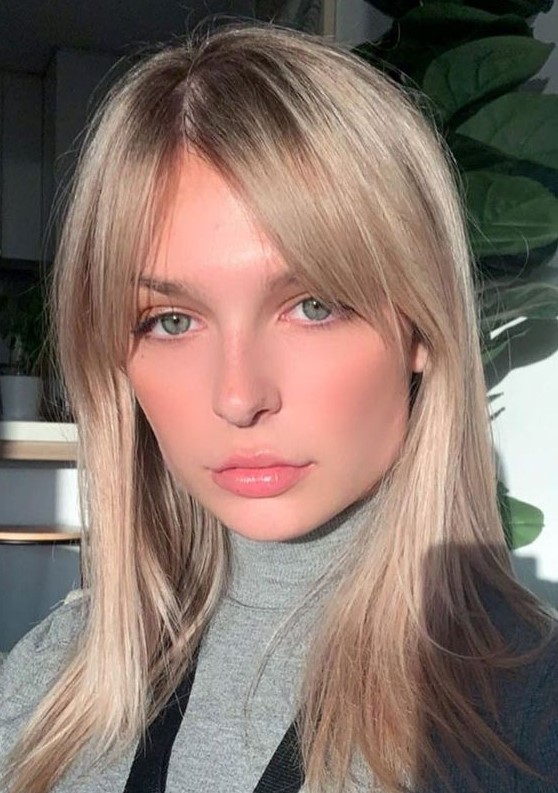 long blonde locks with curtain bangs and plenty of texture are a beautiful idea to rock any time