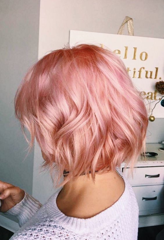 a bright pink bob with shiny waves and side bangs is a catchy and cool idea to rock in summer