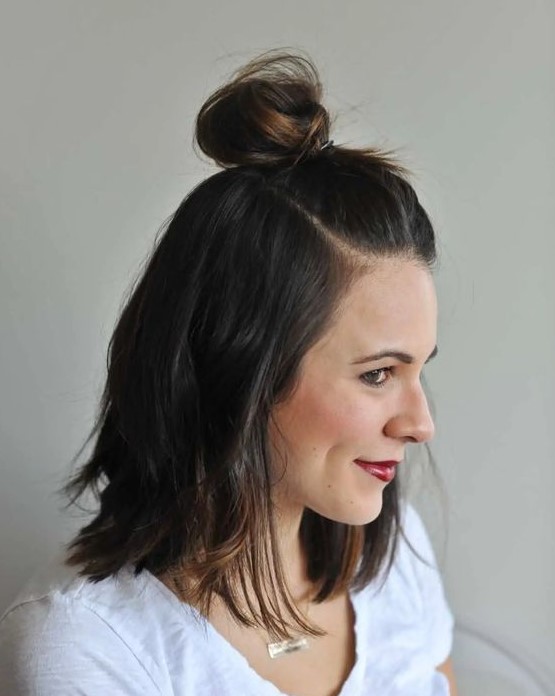 a half top knot is a simple idea when you are in a hurry and you may use a bit of dry shampoo to refresh the hair